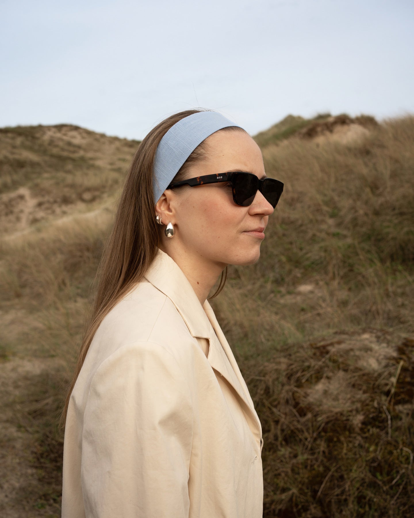 model wearing bandega headband walking in nature